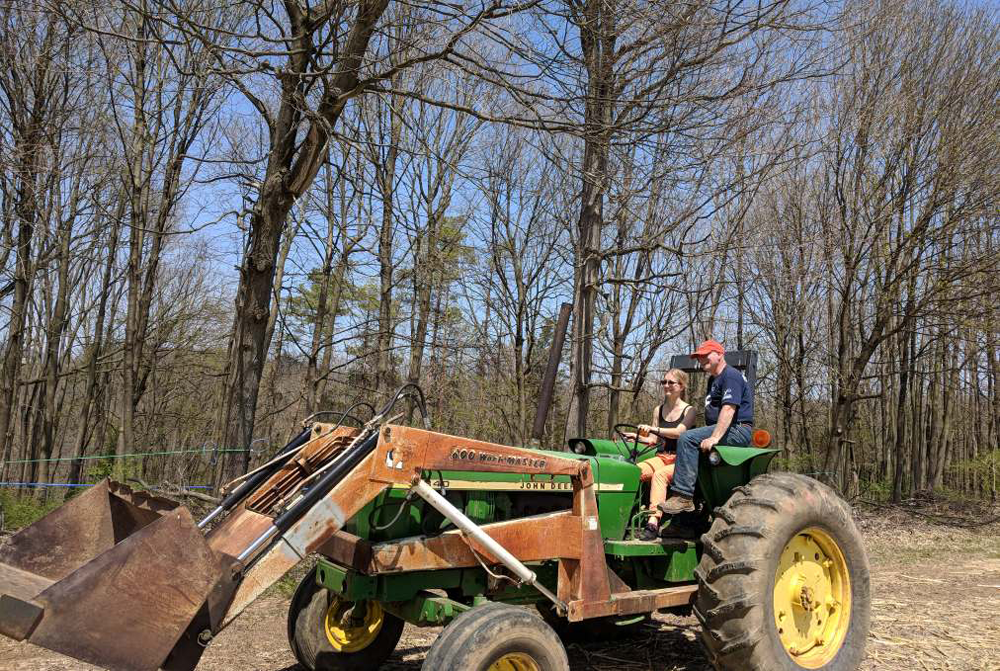 Veronika driving a tractor